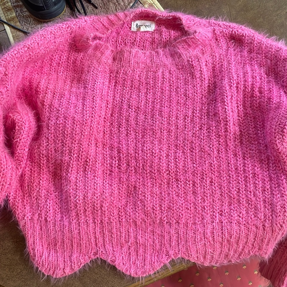 This is a SUPER soft pink sweater that is so cute